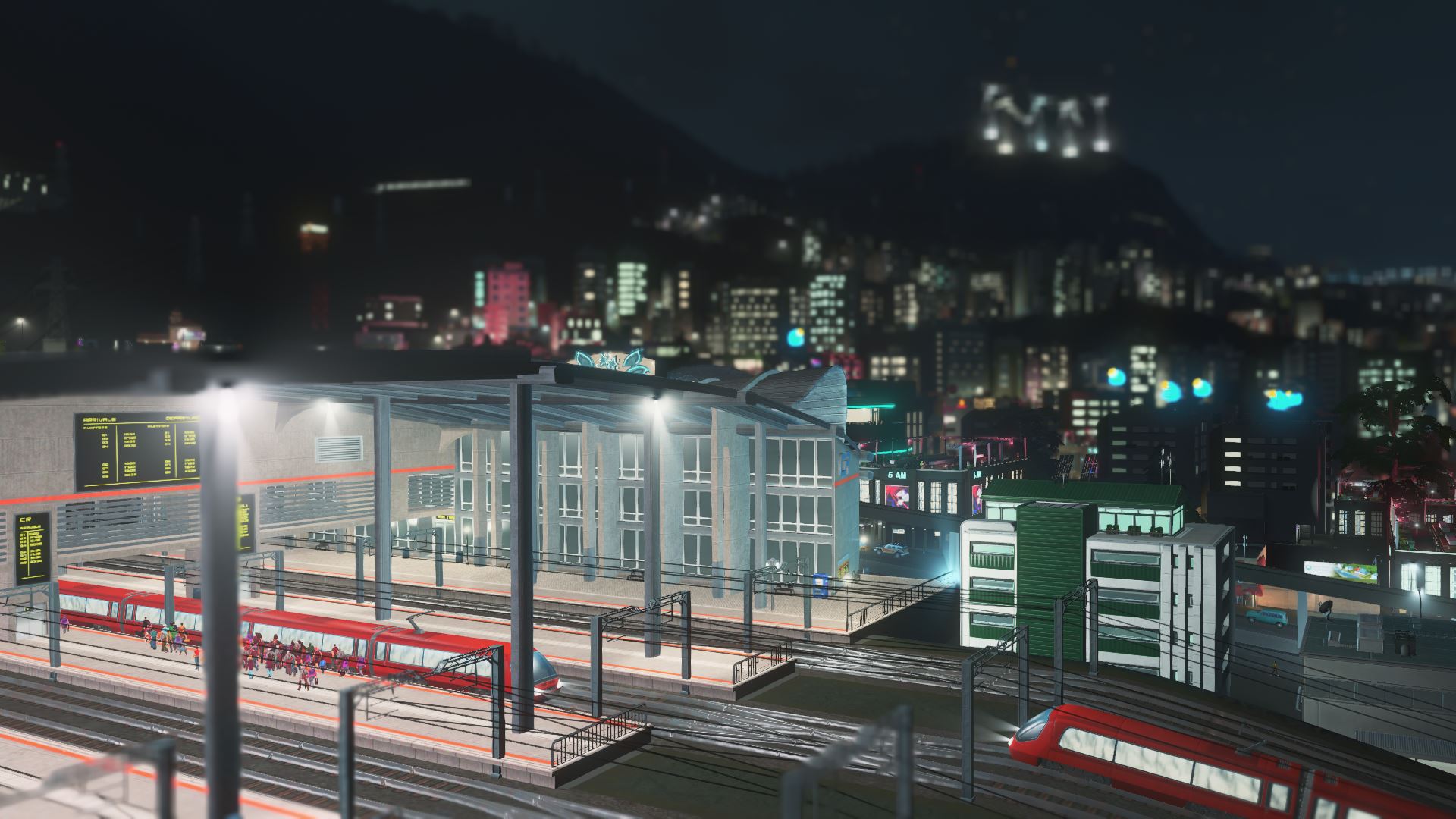 Endstation eines großen Bahnhofs in Cities: Skylines bei Nacht.